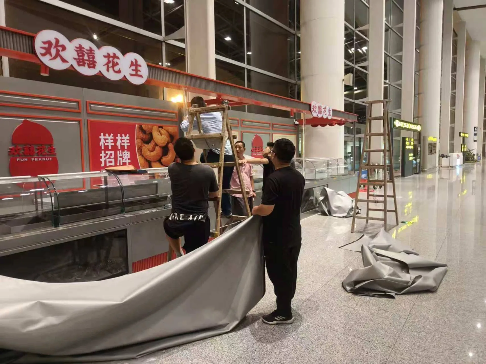 Overnight installation in progress at a transit hub